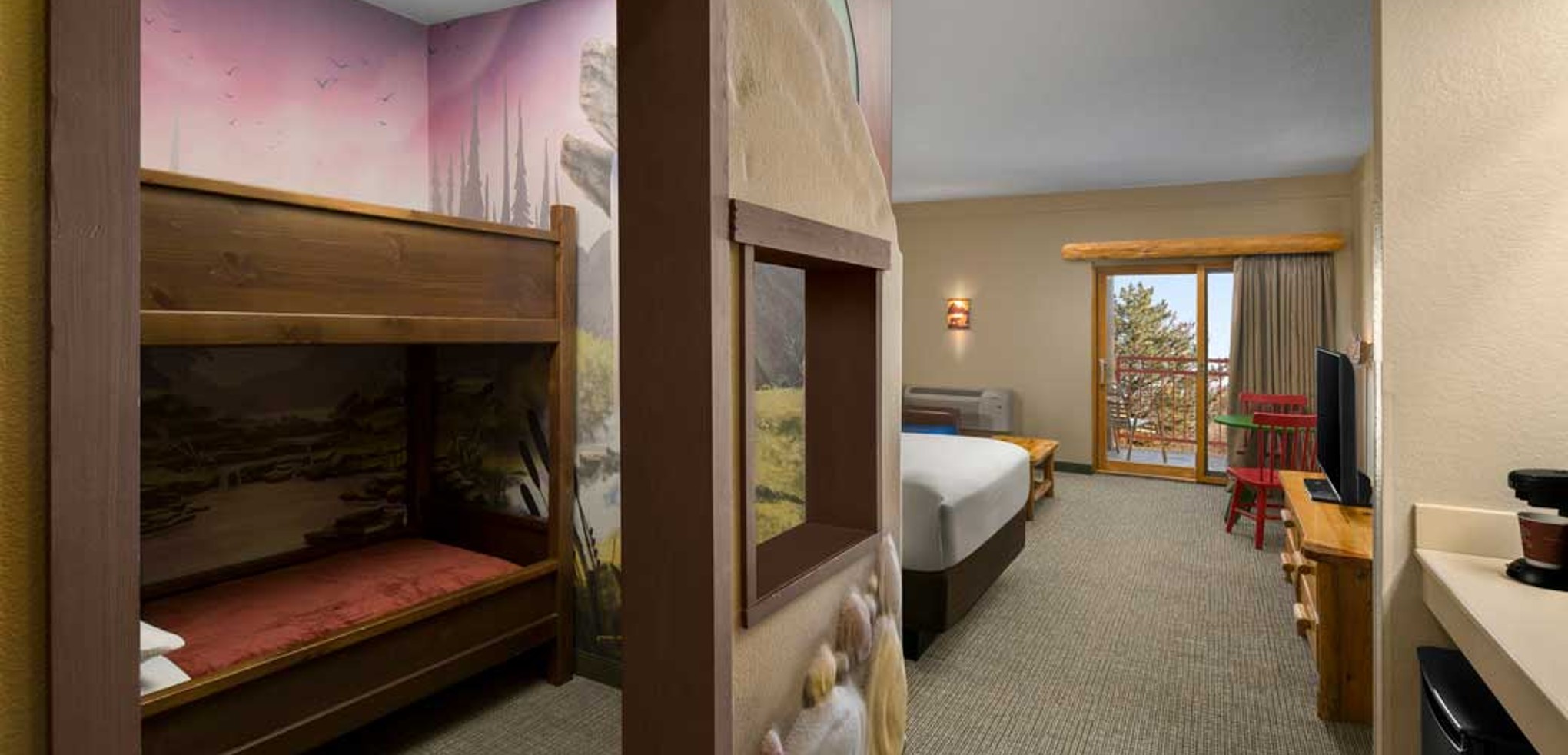 The bed and den inside the Wolf Den Suite at Great Wolf Lodge indoor water park and resort in Sandusky, OH.